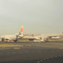 a jetstar plane and a qatar airways plane at sydney airport